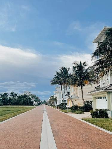 Line of houses with cobblestone sidewalk